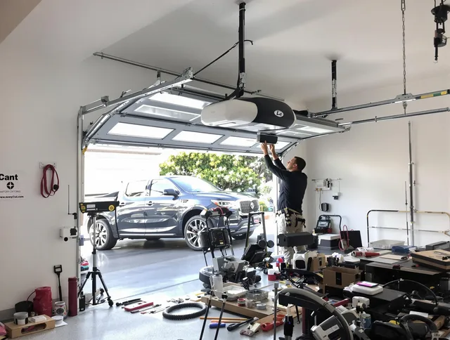 Norco Garage Door Repair specialist installing smart garage door opener system in Norco home